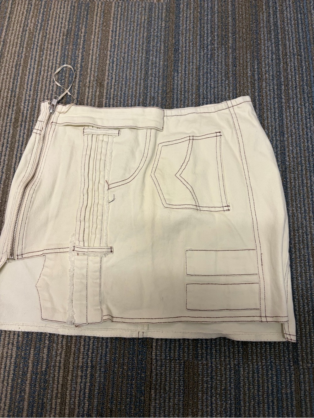 AKIRA Cream Mini Skirt with Black Logo Tag